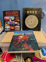 Front covers of the three books on table
