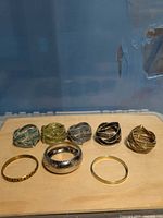 All eight bracelets laid out showing variety