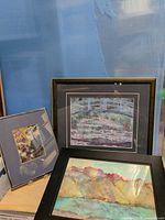 Three framed art prints grouped