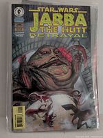 Front cover showing title, artwork of Jabba the Hutt, barcode, bagged