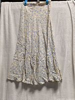 Full view of skirt hanging to show shape and length