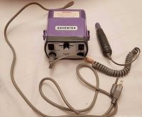 Full view of Adventek control unit with handpiece and cords