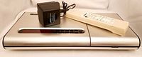 Music Center front view with remote and power adapter