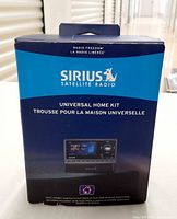 Front of sealed Sirius Satellite Radio Universal Home Kit box