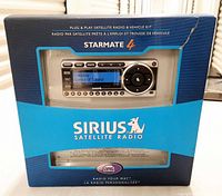 Front of sealed retail box showing Starmate 4 unit and branding