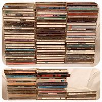 Two tiers of approximately 129 CD jewel cases stacked together