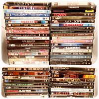 Front view of all stacked DVD cases showing titles and quantity
