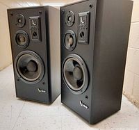 Full view of both Infinity SM112 speakers standing side by side