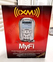 Front of sealed Delphi MyFi XM2Go retail box