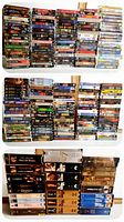 Front view showing three large groups of stacked VHS tapes in cases