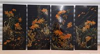 All four lacquer panels side by side