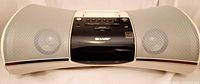 Front view of Sharp DK-A1 stereo showing overall design and speakers