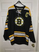 Full front view of jersey on hanger