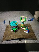 Assembled set showing house, tower, phantoms on fabric background