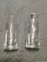 Front view showing both Roscher crystal glasses and dot pattern