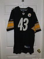Full view of front of jersey showing number 43 and sleeve stripes