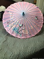 Parasol open showing full painted scene and overall condition