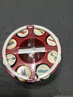Top view of carousel showing coins with car images and colour groupings