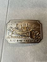 Front view of buckle showing full design and text