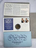 Full set showing sleeve, insert and first day cover with medallion
