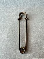 Full view of 3-inch metal safety pin
