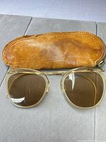 Sunglasses front view with leather case