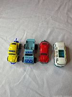 All four die-cast vehicles lined up