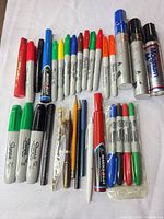 Full group shot showing all markers, pens, pencils and sealed pack