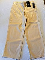 Full view of beige faux leather cropped pants