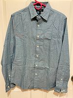 Front view of Banana Republic light blue chambray microdot shirt hanging