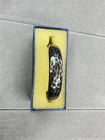 Cuff bracelet in foam-lined box