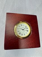 Front view of square mahogany desk clock