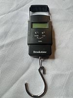 Front view showing entire scale with hook and handle