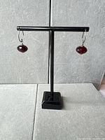 Both earrings hanging on stand showing overall design