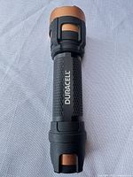 Full view of Duracell LED flashlight showing body, grip and branding