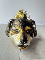 Front view of glass dog head ornament