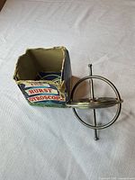 Gyroscope beside open original box