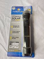 Front view of packaged HybridLight Peterson solar flashlight