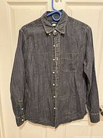 Full front view of shirt showing overall appearance, color, button-front, sleeves