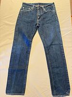 Full view of Levi's dark blue straight jeans