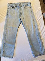 Full front view of jeans laid flat