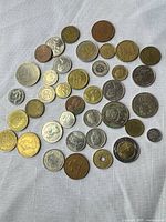 All 36 coins laid out showing obverse designs and metal colours