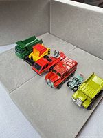 All six toy vehicles arranged together