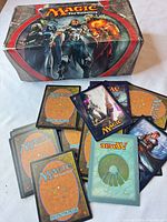 Closed 2012 Core Set booster box with sample loose cards spread out