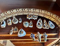 Entire lot on mirrored tray showing variety of shapes and motifs