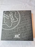Closed box top showing Montblanc logo and silver script design