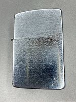 Front view of chrome lighter showcasing wear