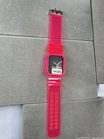 Full view neon pink silicone watch band with integrated case