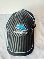 Front view showing logo, stripes and piping