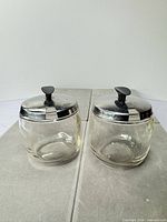 Pair of Foley glass jars front view